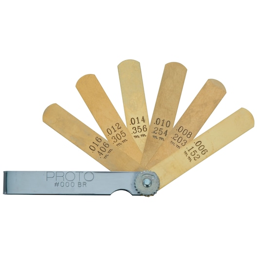 PROTO J000BR photography of brass feeler gauge set with six blades fanned out, white background.