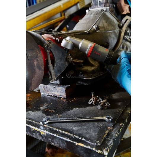 PROTO J150WA ratcheting wrench and power tool used on machinery, with bolts and washers on a workshop table.