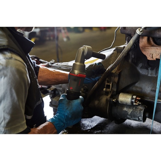PROTO J150WA pneumatic tool in use by a mechanic wearing blue gloves, working on an automotive part.