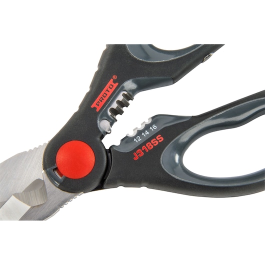 Close-up image of a pair of PROTO J318SS photography scissors with black and grey handles, a red pivot joint, and visible measurement markings.